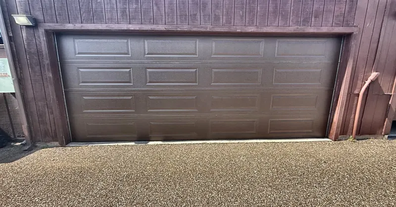 Brown raised-panel double garage door